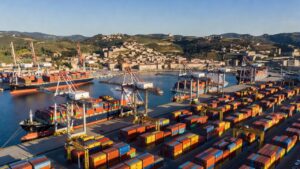 Aerial view of an Italian container port with gantry cranes and ships